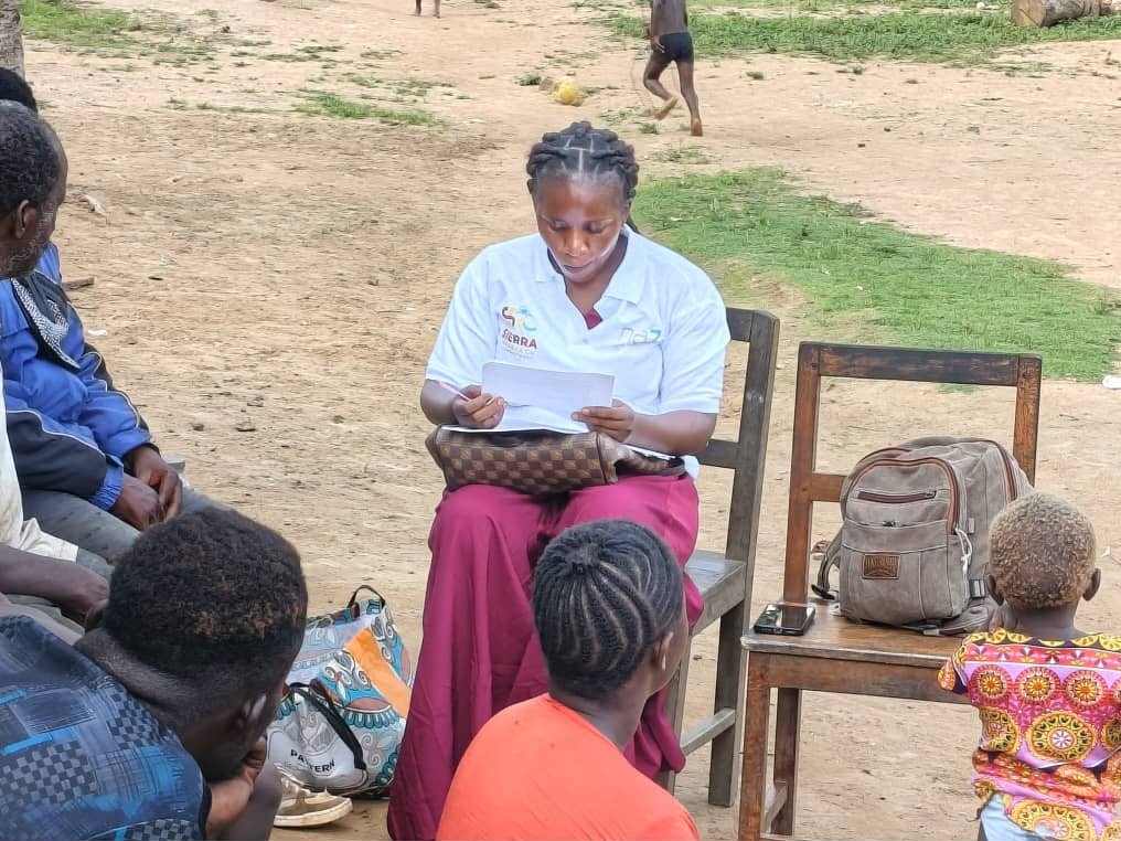 Enumerator recording responses during field data collection